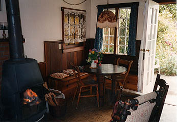 Interior Photgraph of New House showing fireplace and table
